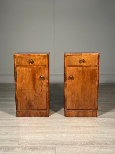 A Pair Of Art Deco Walnut Bedside Cabinets