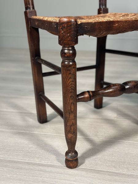 A Pair Of Antique Elm Rush Ladderback Chairs