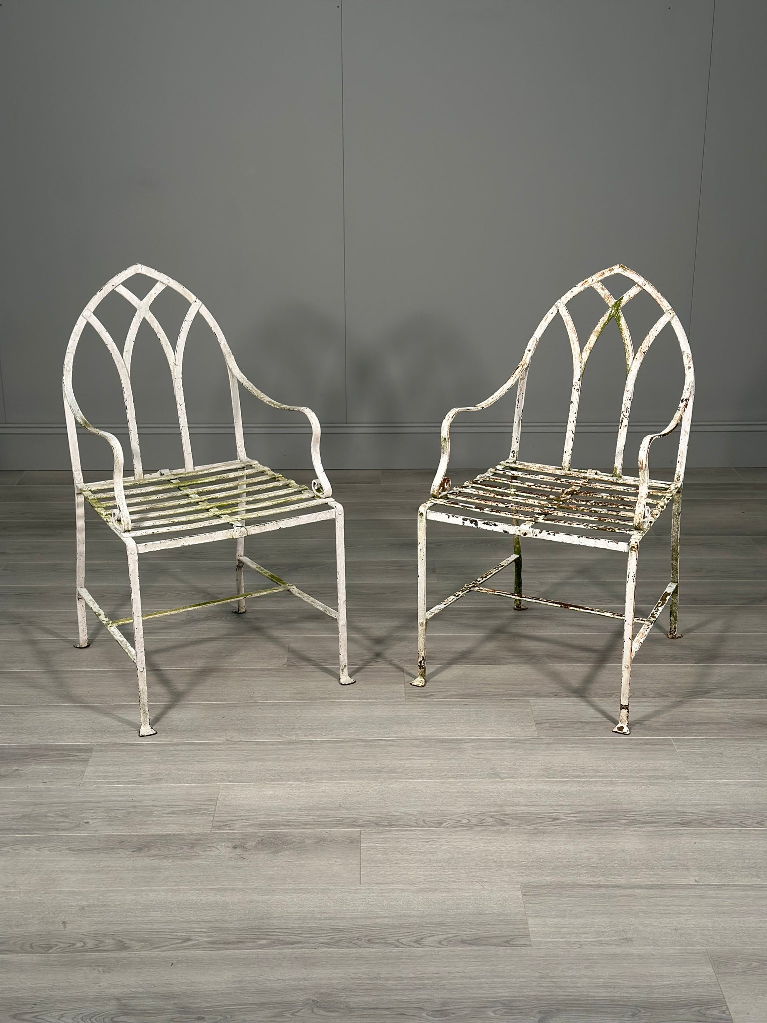 A Pair Of Antique Wrought Iron Garden Chairs