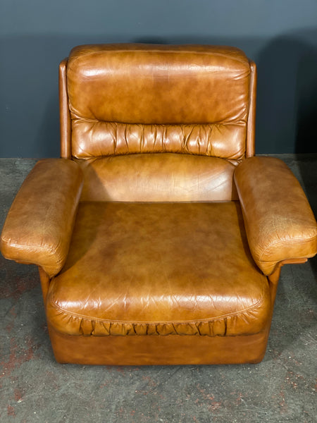 A Vintage Pair Of Rest Assured Leather Arm Chairs