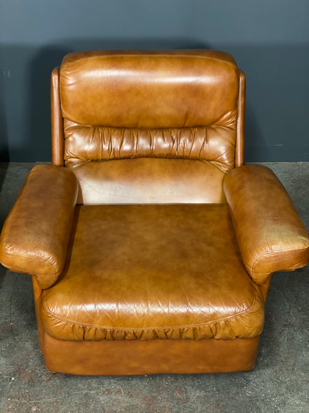 A Vintage Pair Of Rest Assured Leather Arm Chairs