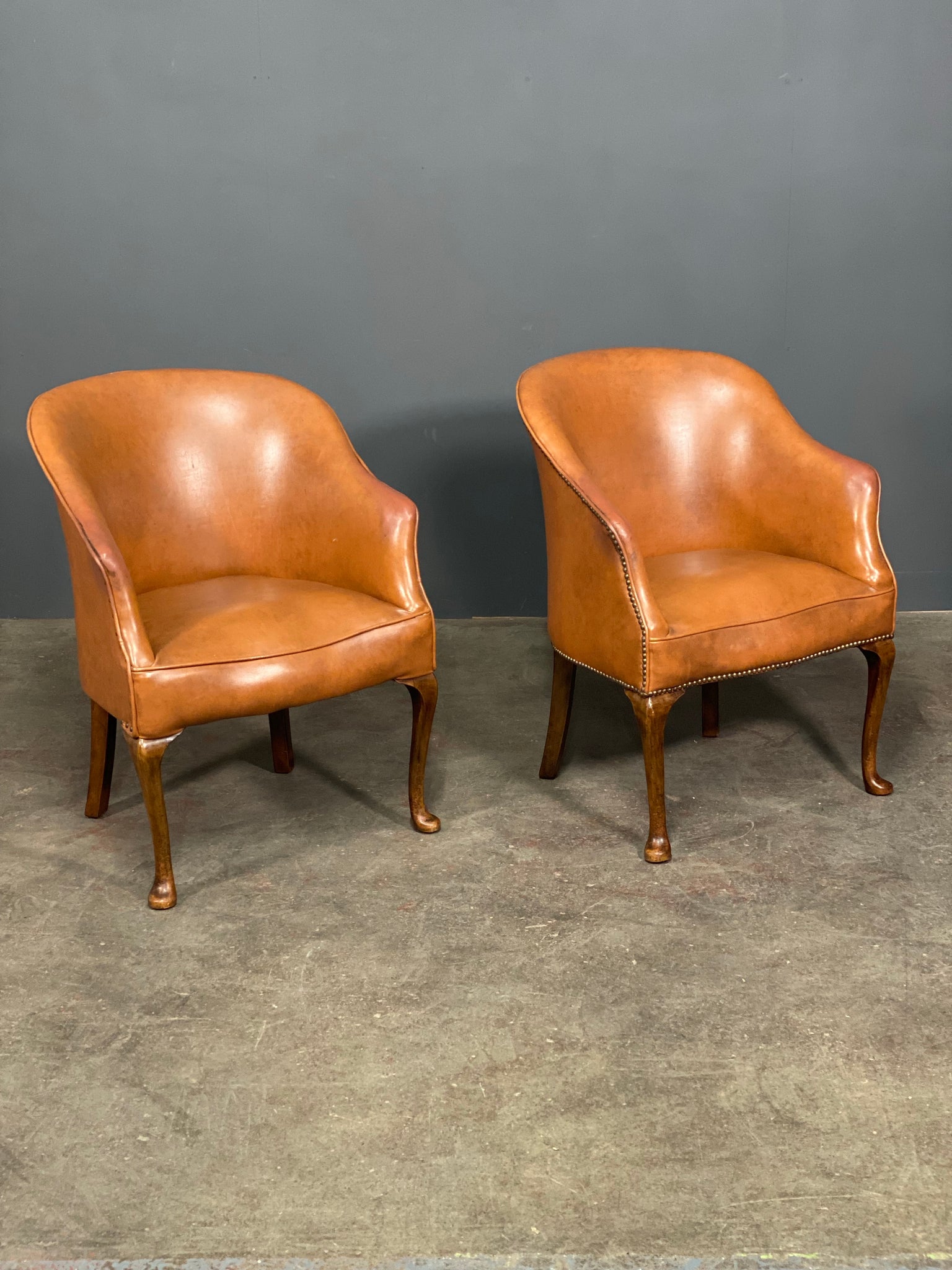 A Pair of Vintage Tub Chairs