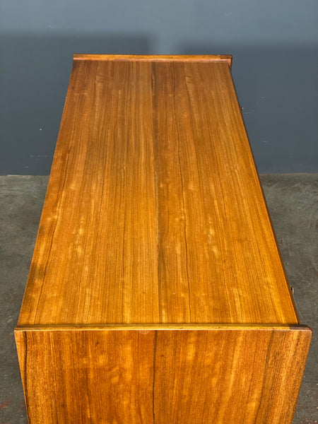 A Younger Walnut Chest Of Drawers by John Herbert