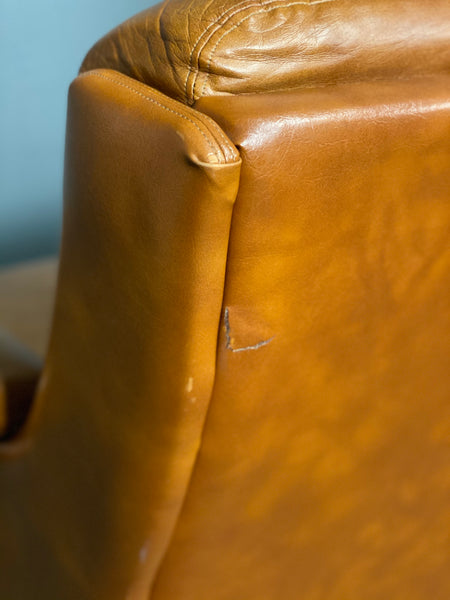 A Vintage Pair Of Rest Assured Leather Arm Chairs