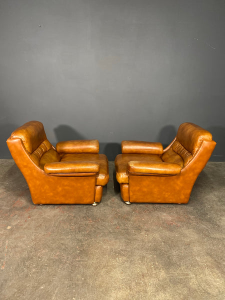 A Vintage Pair Of Rest Assured Leather Arm Chairs
