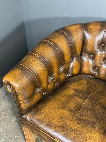 A Pair Of Vintage Chesterfield Tub Chairs