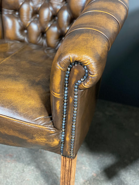 A Pair Of Vintage Chesterfield Tub Chairs