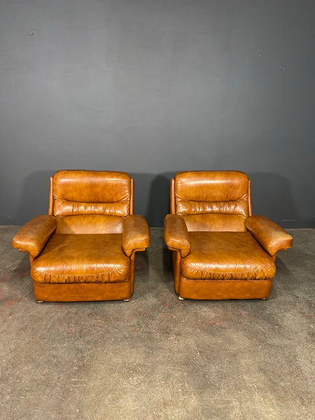 A Vintage Pair Of Rest Assured Leather Arm Chairs