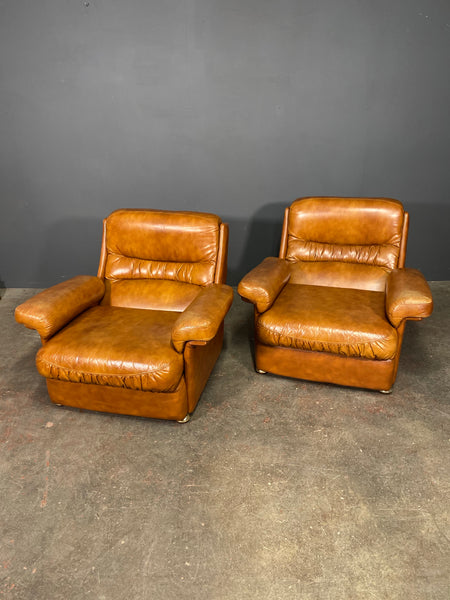 A Vintage Pair Of Rest Assured Leather Arm Chairs