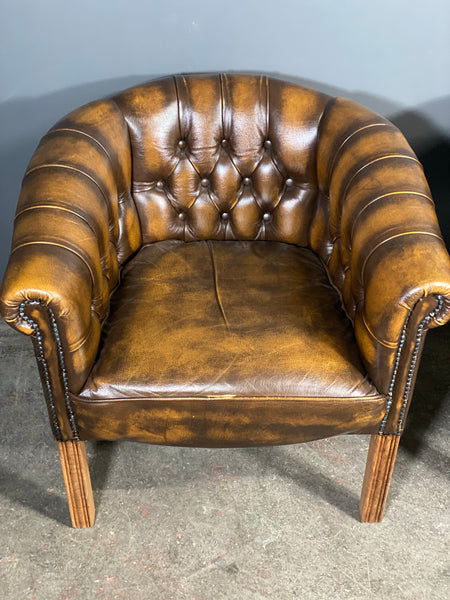 A Pair Of Vintage Chesterfield Tub Chairs