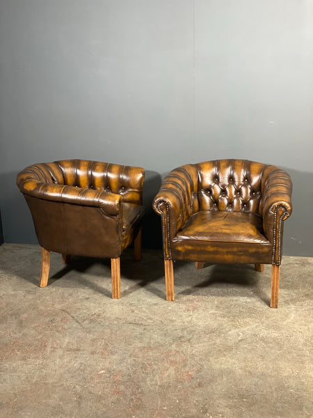 A Pair Of Vintage Chesterfield Tub Chairs