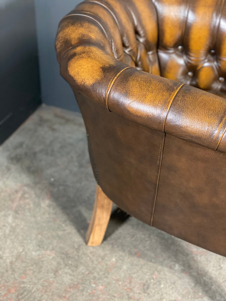 A Pair Of Vintage Chesterfield Tub Chairs